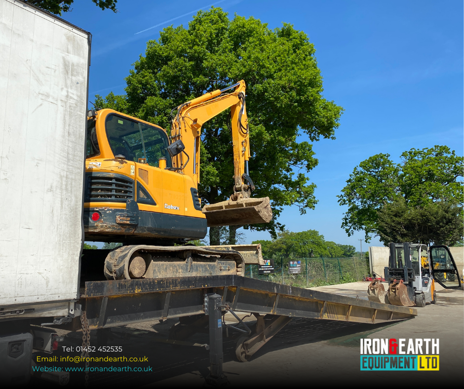 Used Excavator Export. Used Excavator being loaded into Sea Container ready for export.