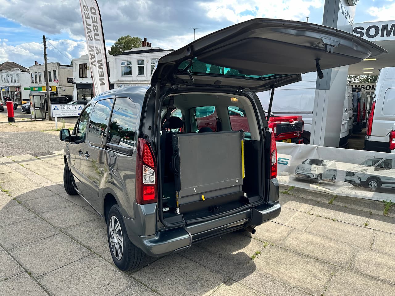 Wheelchair accessible vehicle showing ramp with the boot up