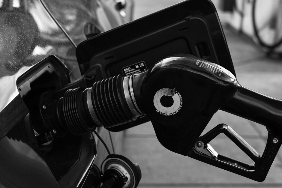 A vehicle being filled with diesel at a fuel pump