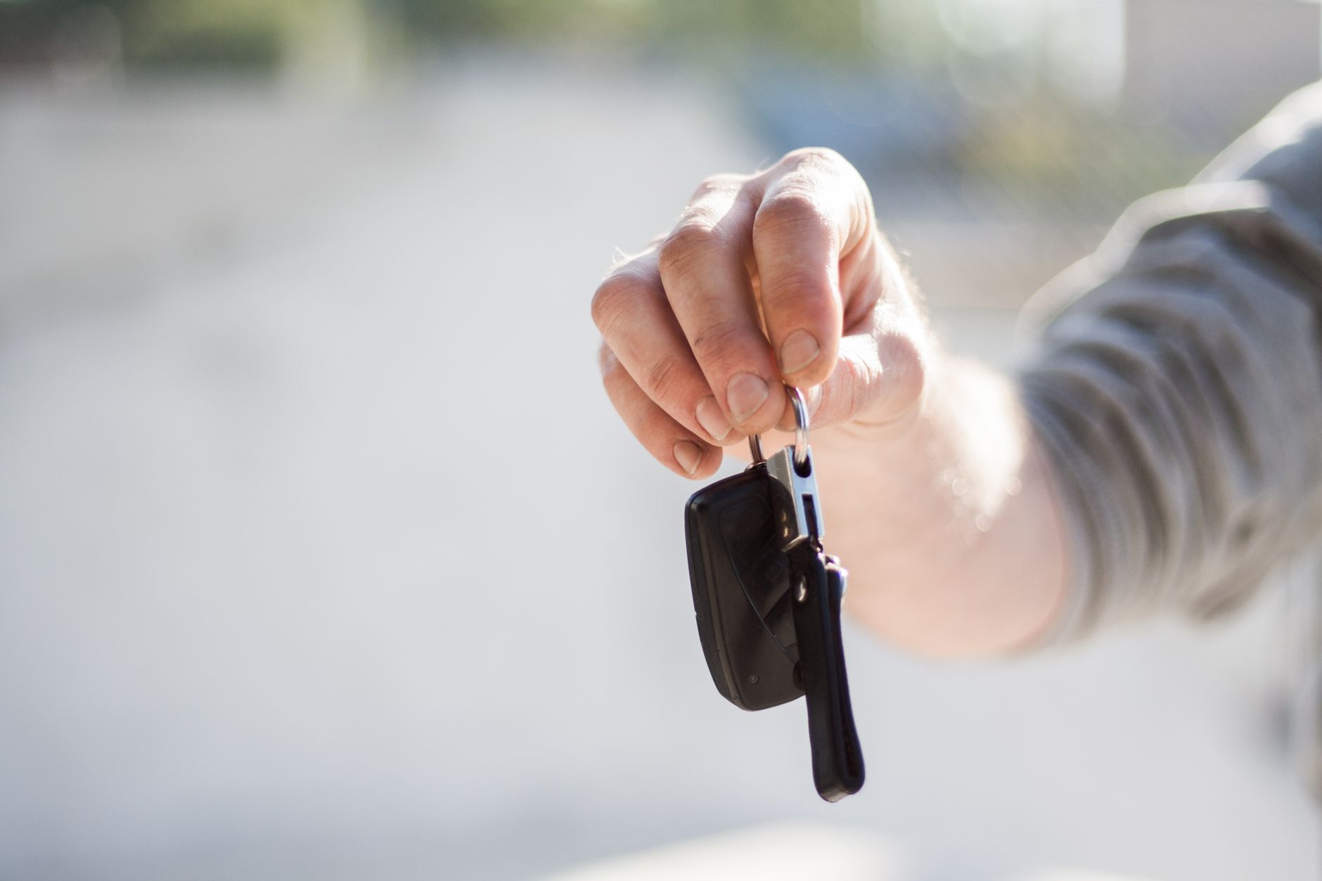 Close-up of a hand holding a set of vehicle keys