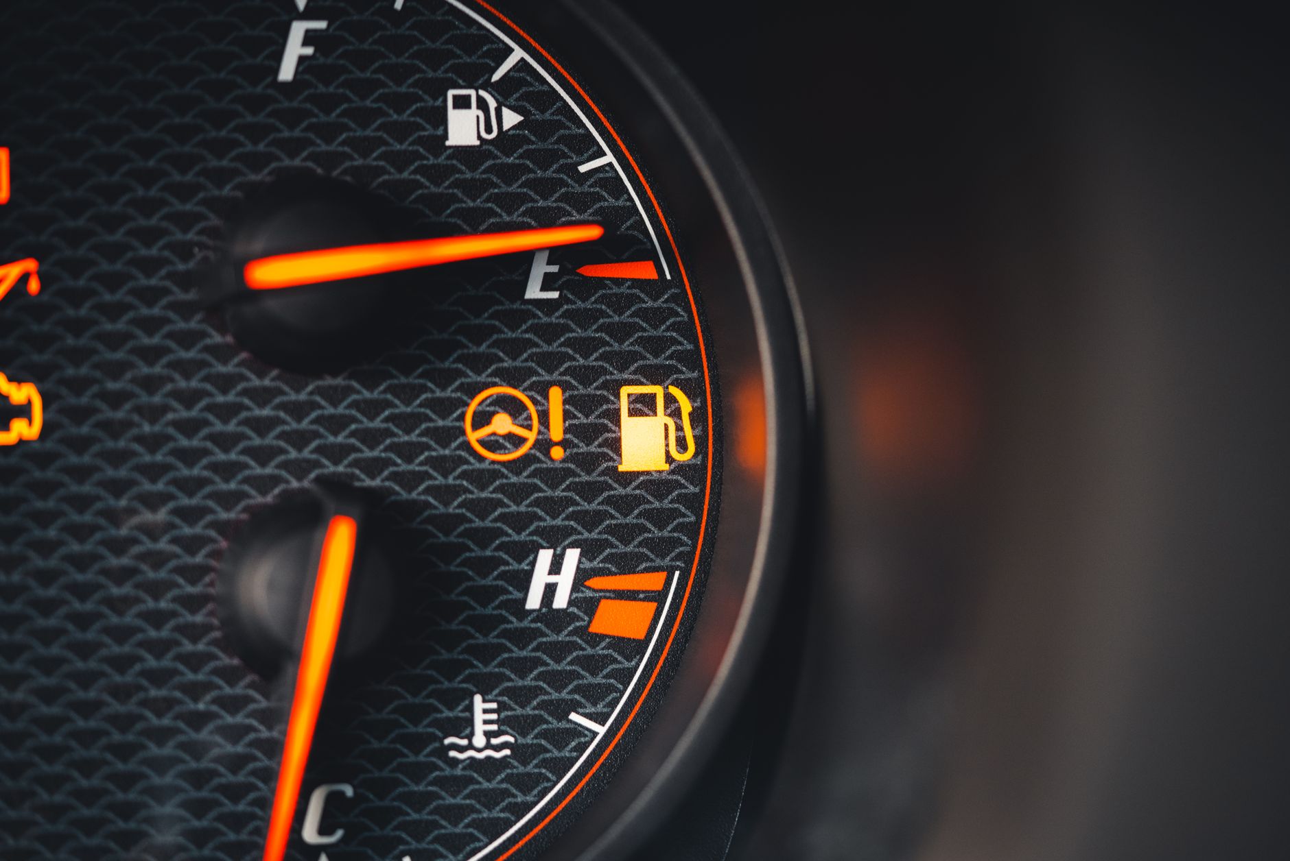 A simple fuel gauge and temperature gauge on a vehicle dashboard