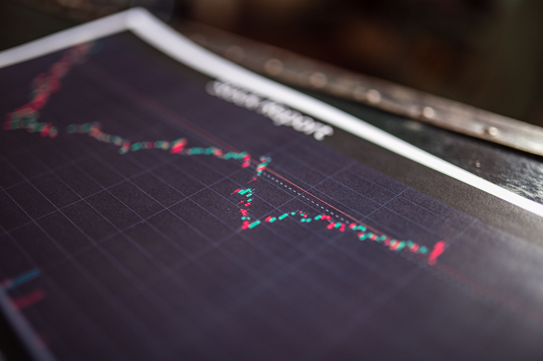 Close-up of a printed report showing a line chart trending downwards over time