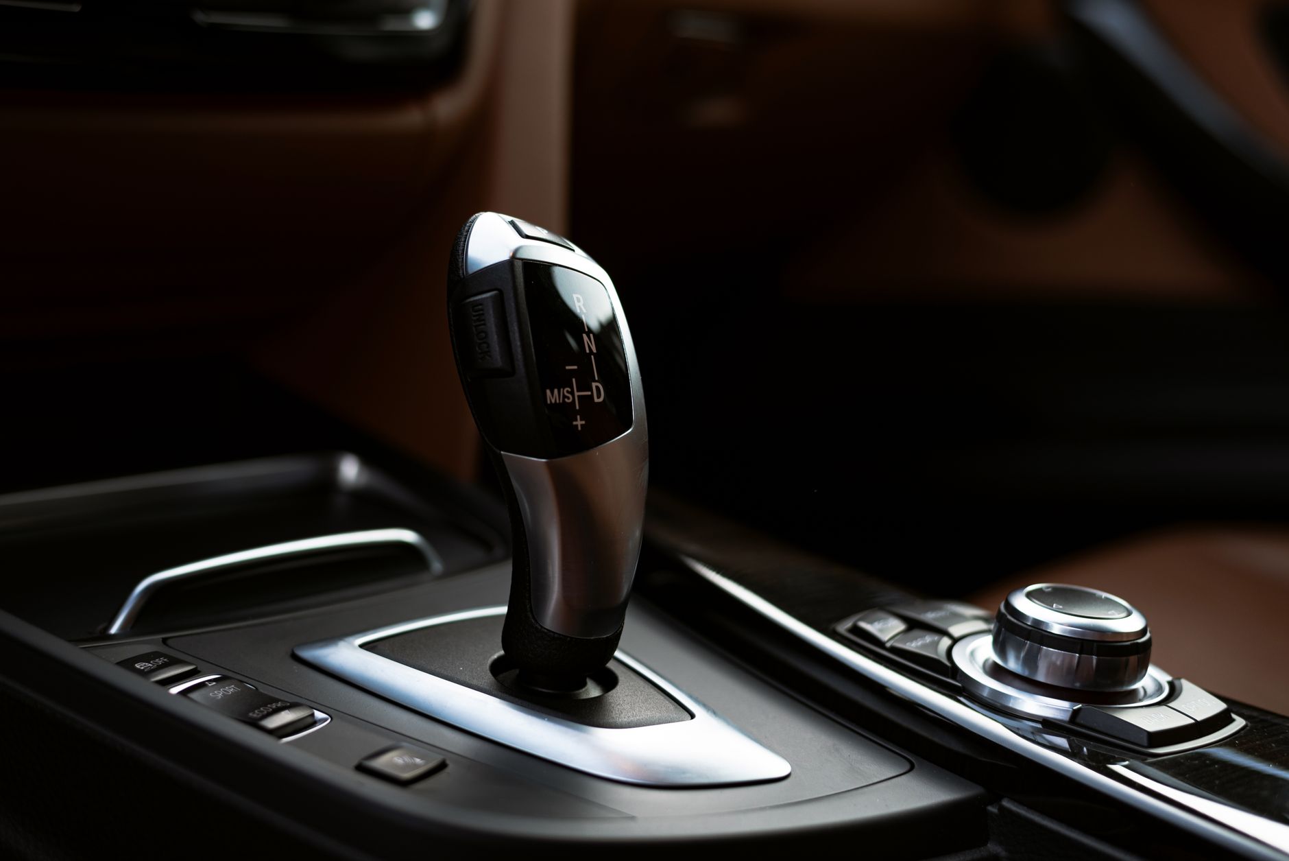 Close-up of an automatic gear selector in a modern vehicle interior