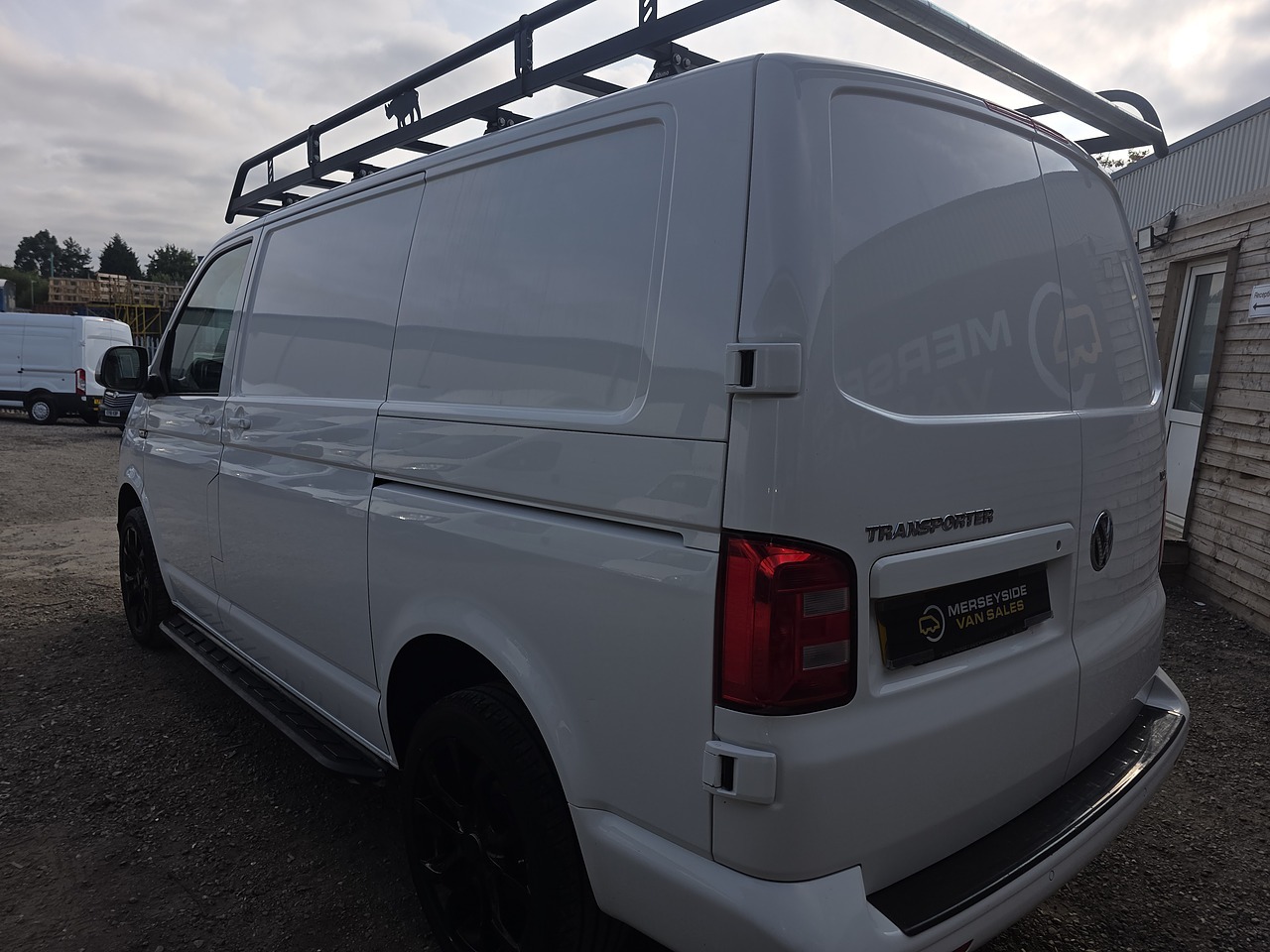 Medium panel van in side profile on our own forecourt showing its load length