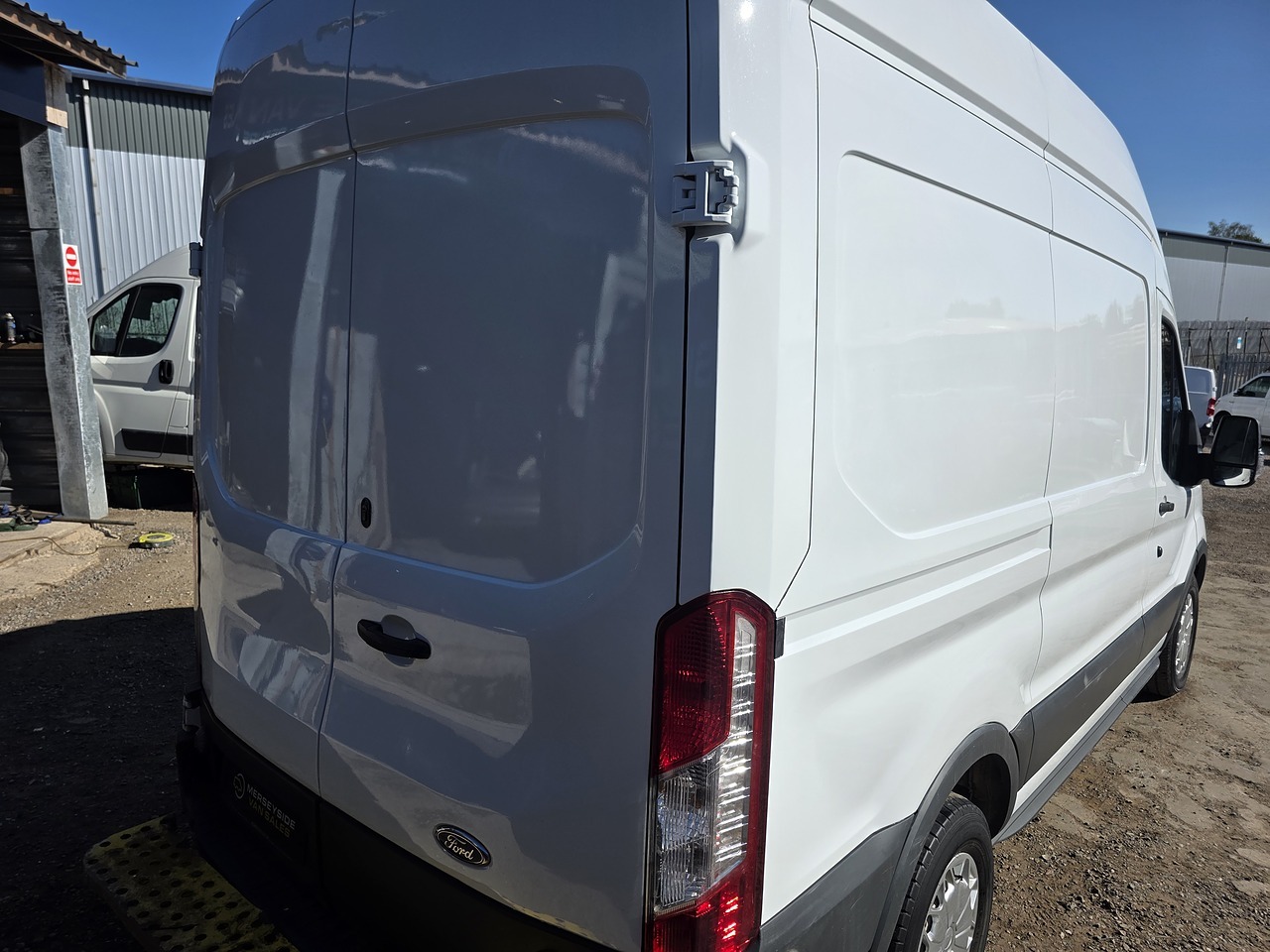 Rear three-quarter view of another full-size Ford Transit on our own forecourt