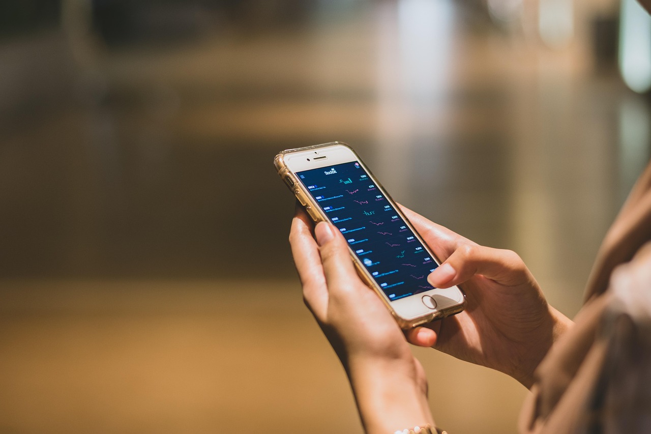 Hands using a banking app on a mobile phone