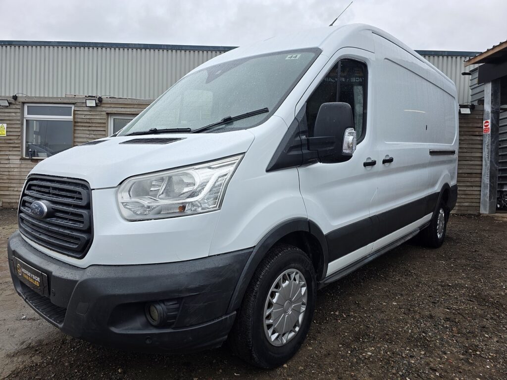 A white full-size Ford Transit long-wheelbase high-roof panel van on the Merseyside Van Sales forecourt