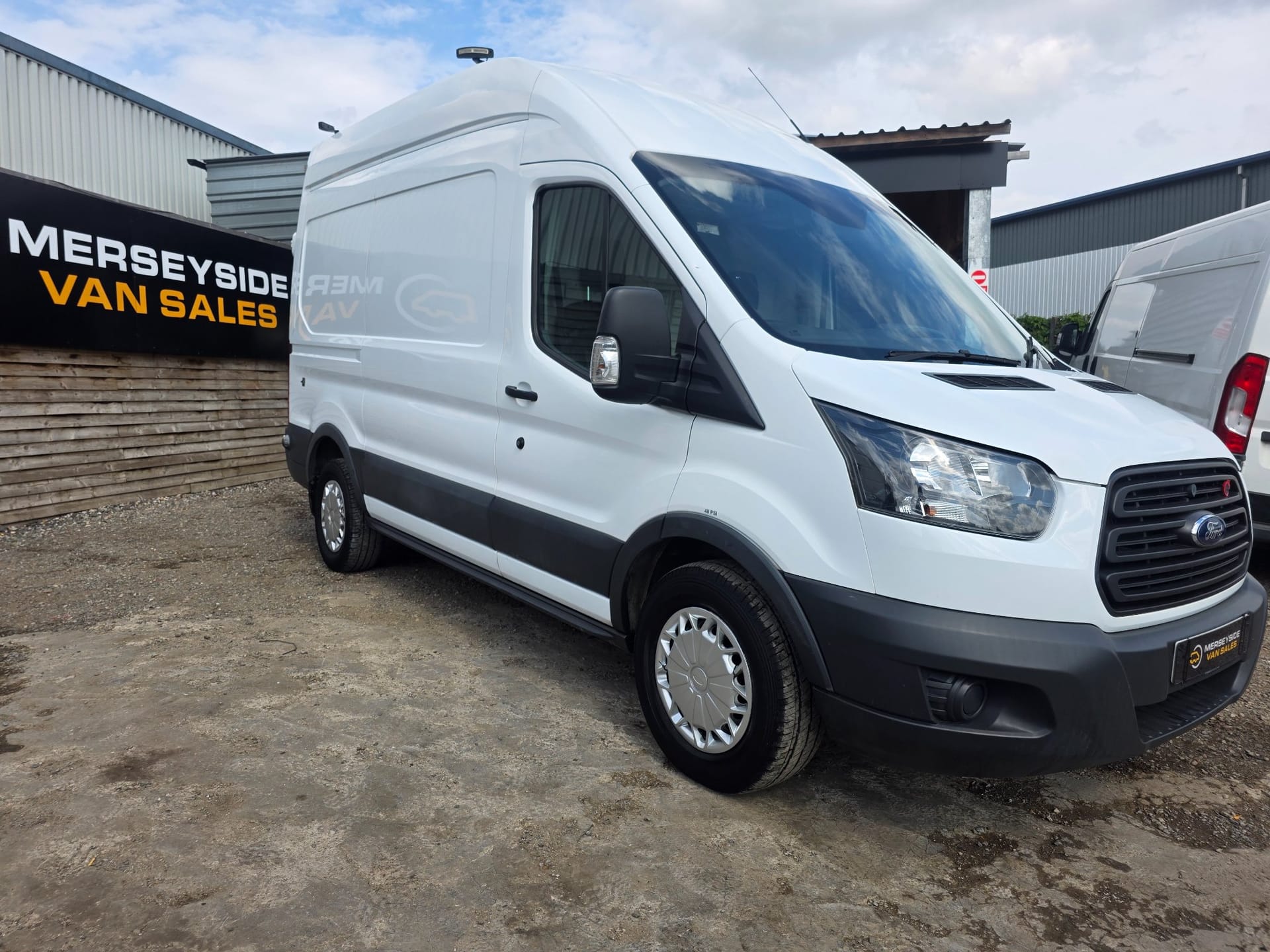 Ford Transit high-roof panel van parked on our gravel forecourt