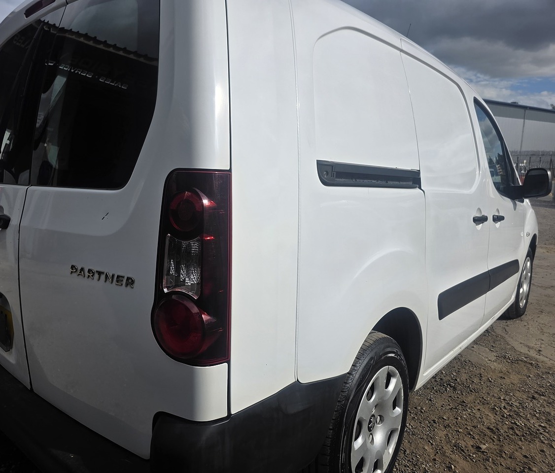 Peugeot Partner combi van seen from the rear three-quarter on our yard