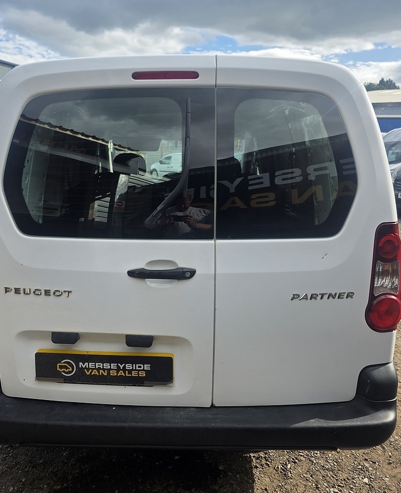 Peugeot Partner combi van photographed from directly behind on our yard