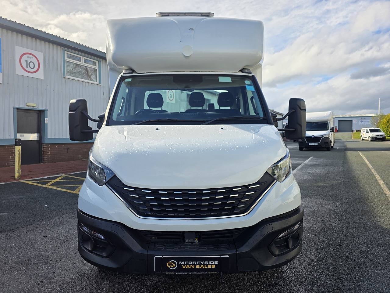 Iveco Daily chassis cab with a high roof pod, front view at our premises