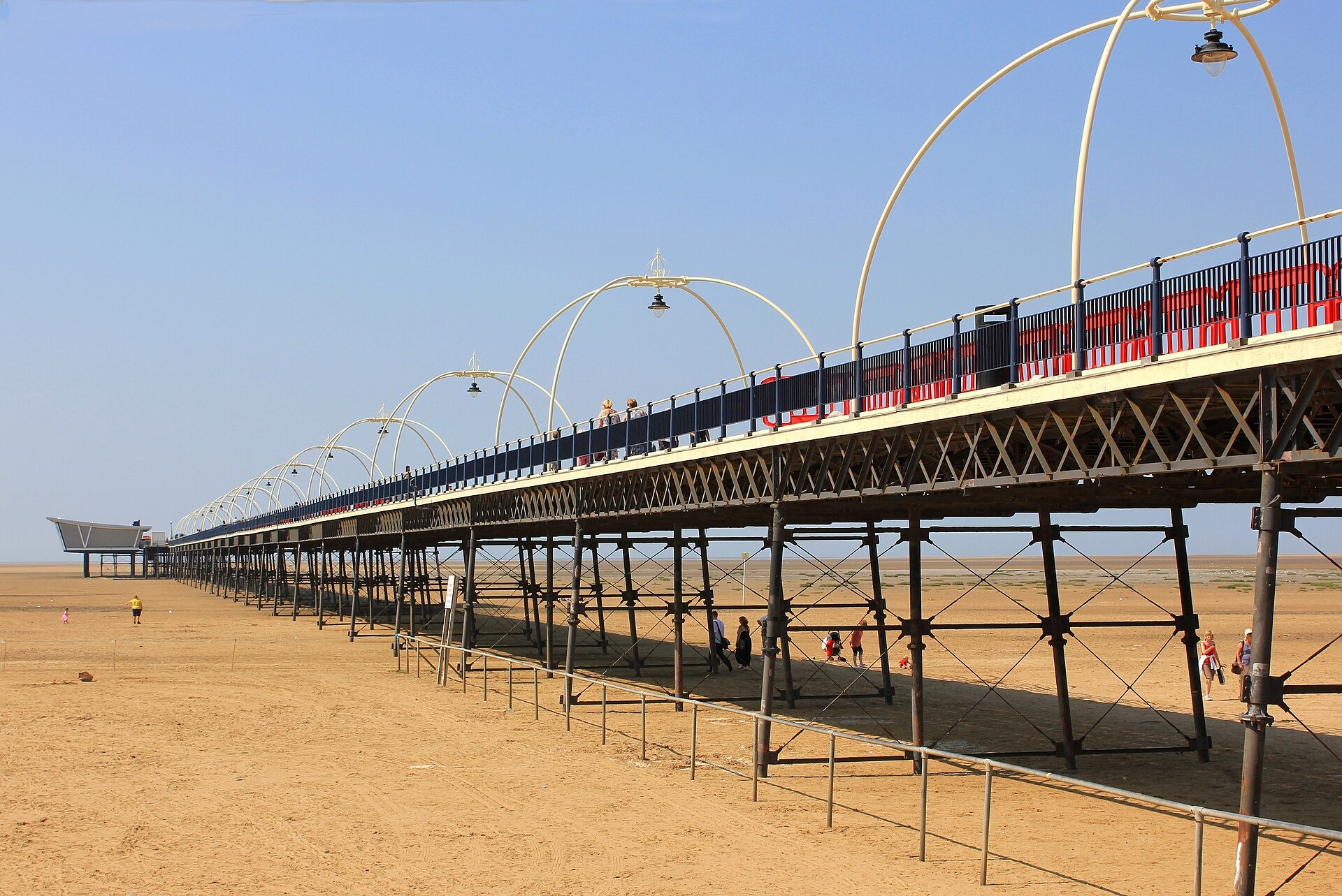 Southport Pier reaching out over the beach on a clear day