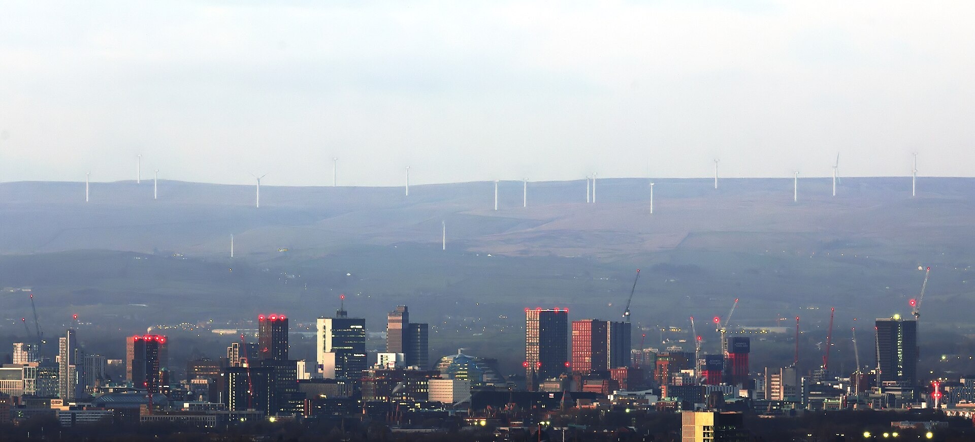 Tall towers of the Manchester city centre skyline seen from a distance