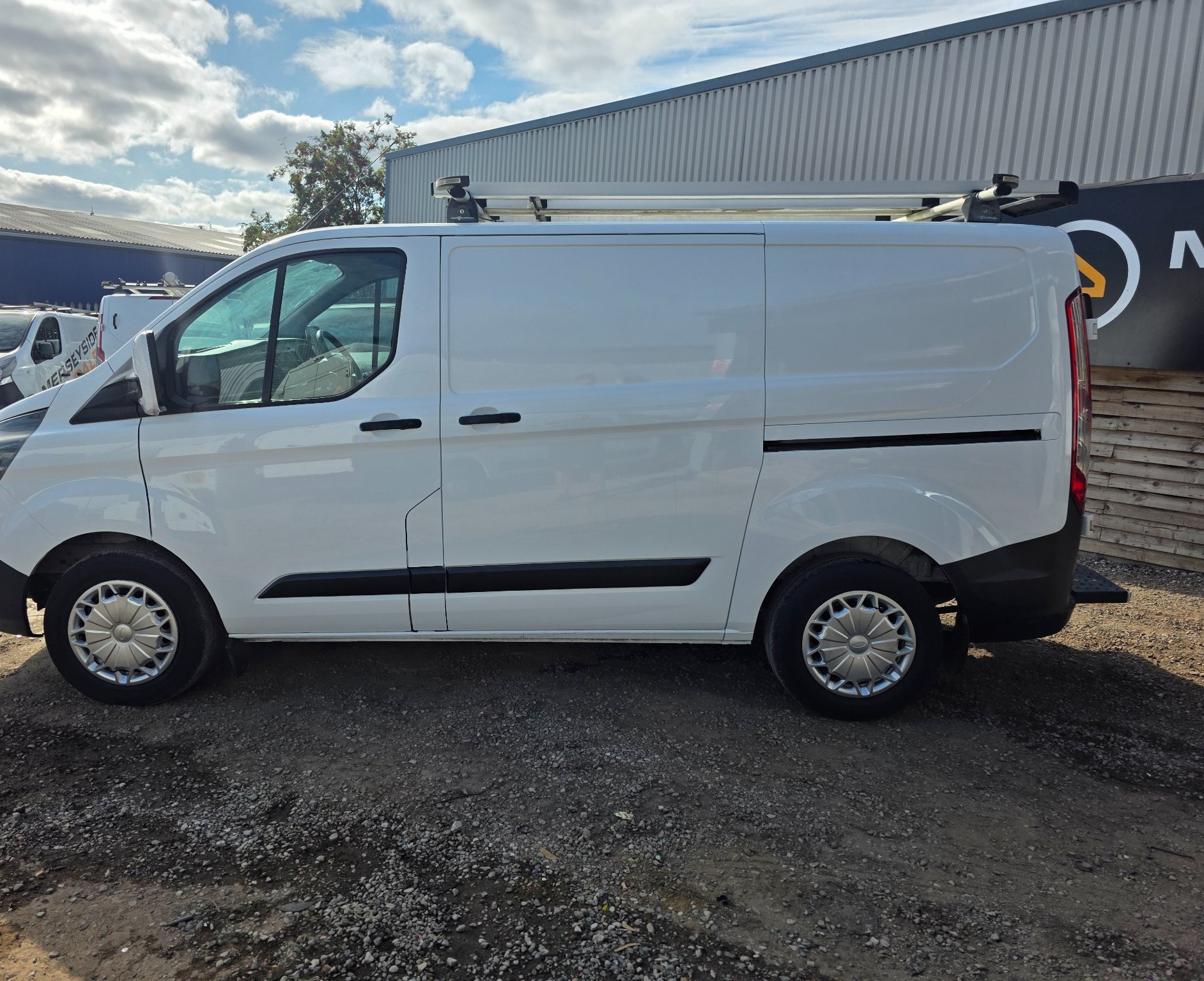 Ford Transit Custom panel van in side profile on our sales forecourt