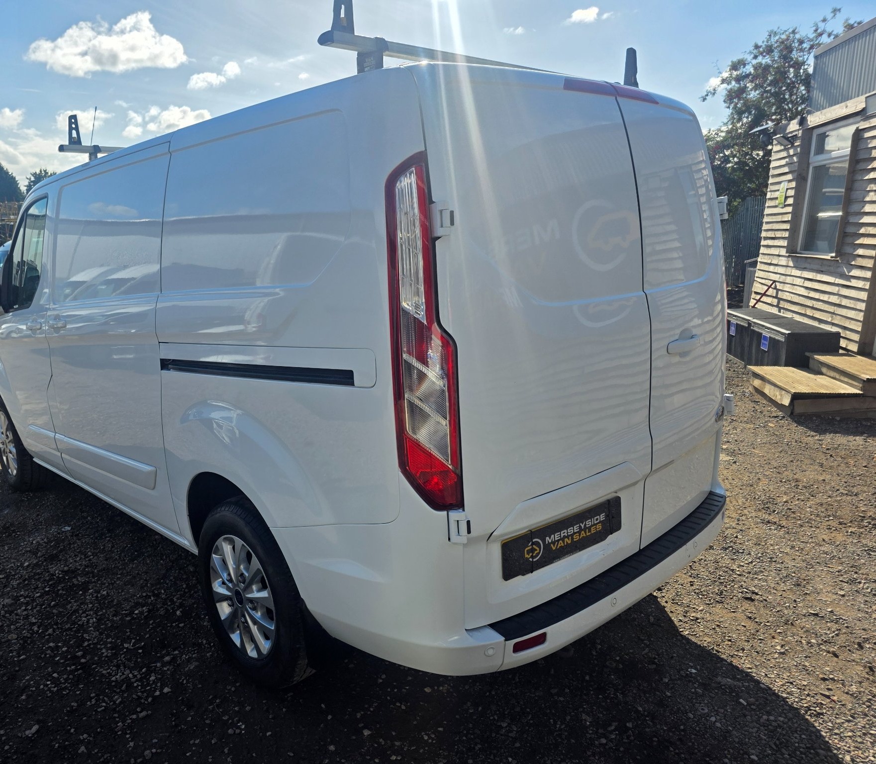 Ford Transit Custom panel van from the rear three-quarter on our forecourt