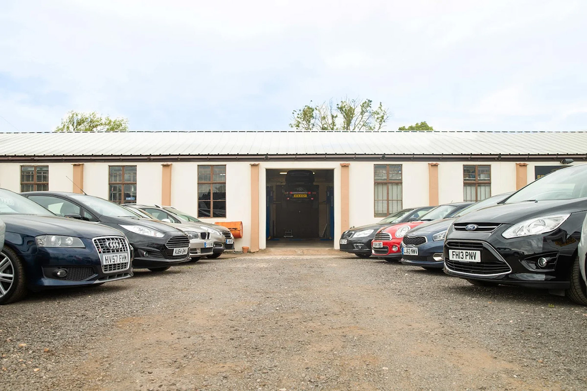 Cars Outside Premises With Garage In Back - Gold Cars Ltd
