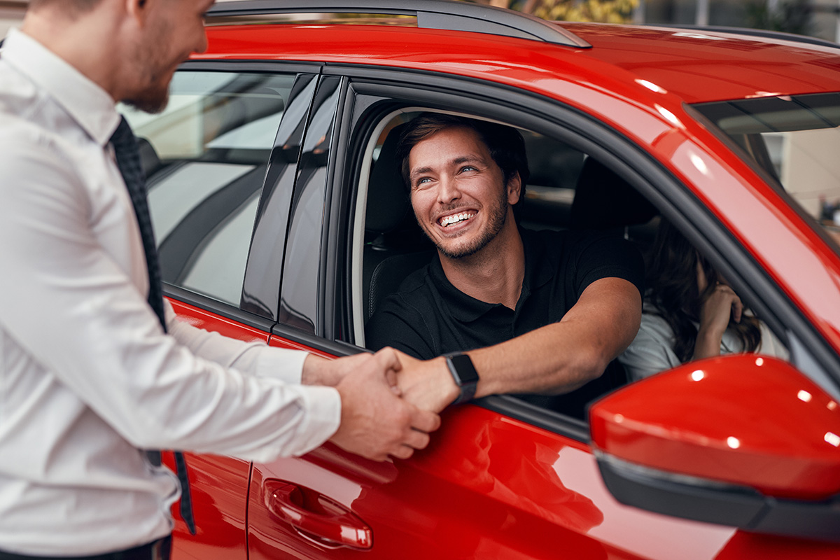 Man Shaking Hands Red Car - Gold Cars Ltd