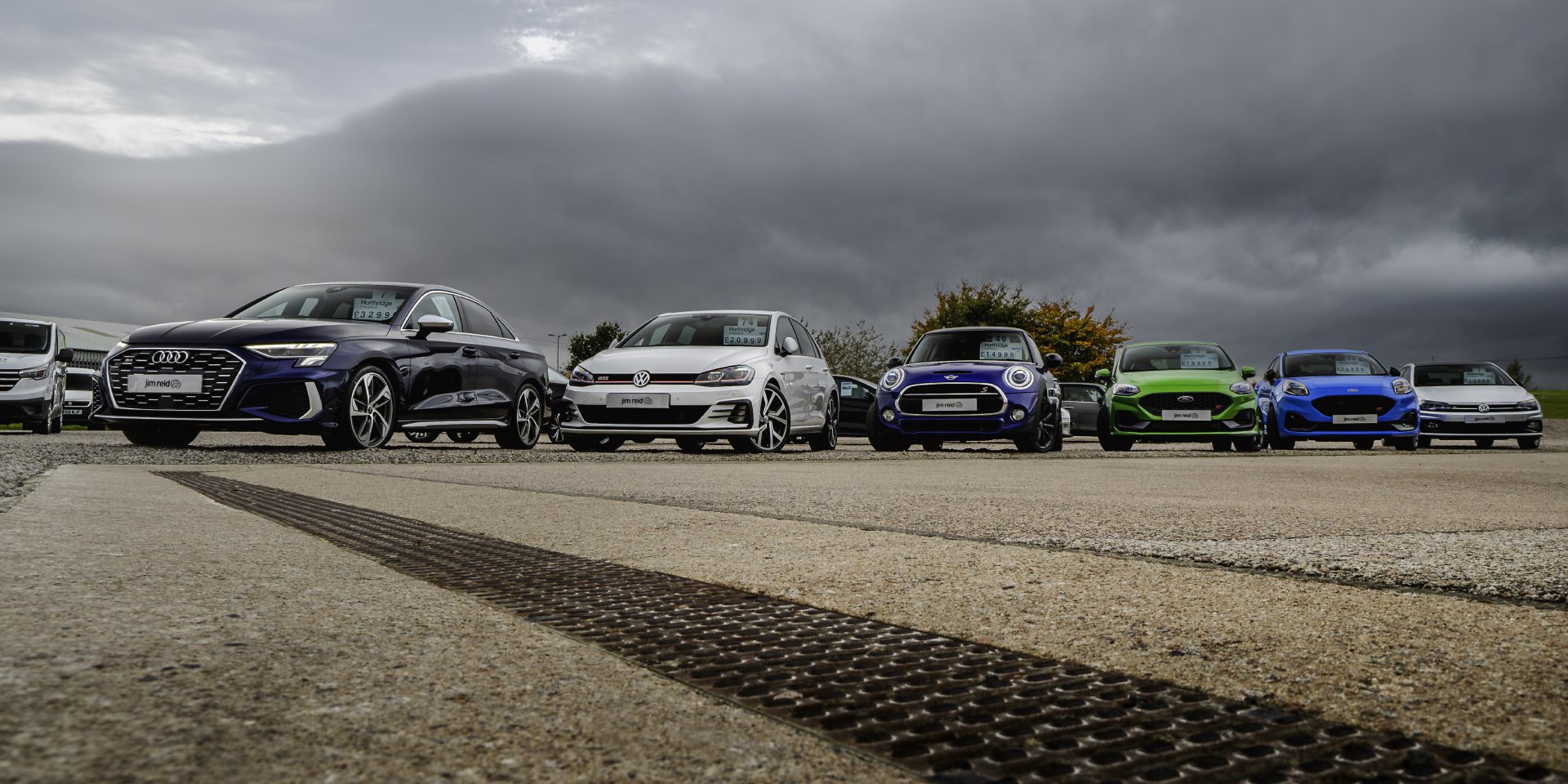 Jim Reid's forecourt with various vehicles on display