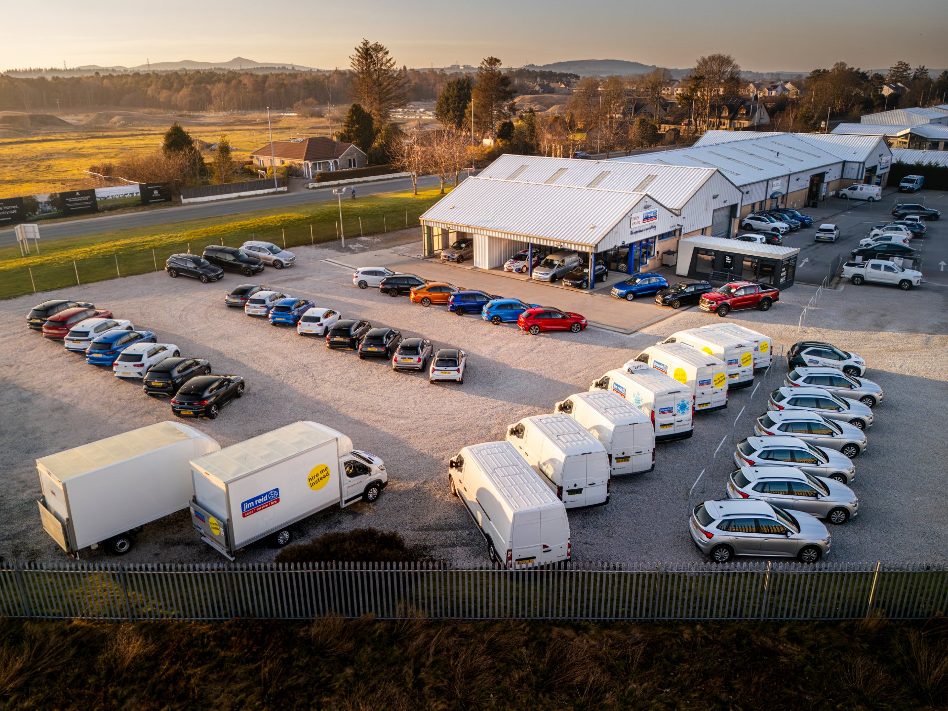 Jim Reid's forecourt with various vehicles on display