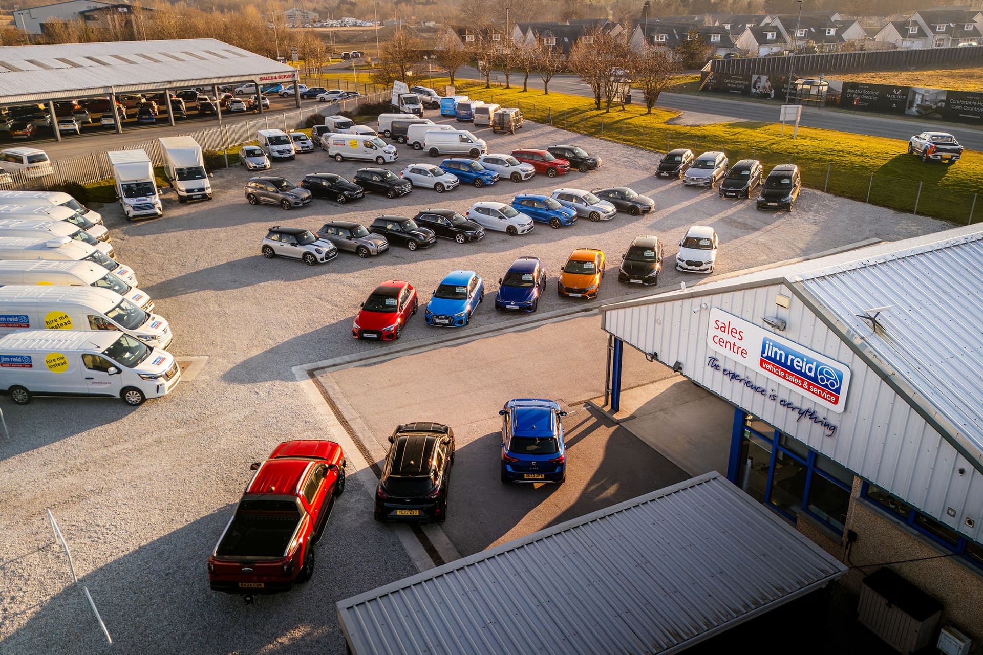Jim Reid's forecourt with various vehicles on display